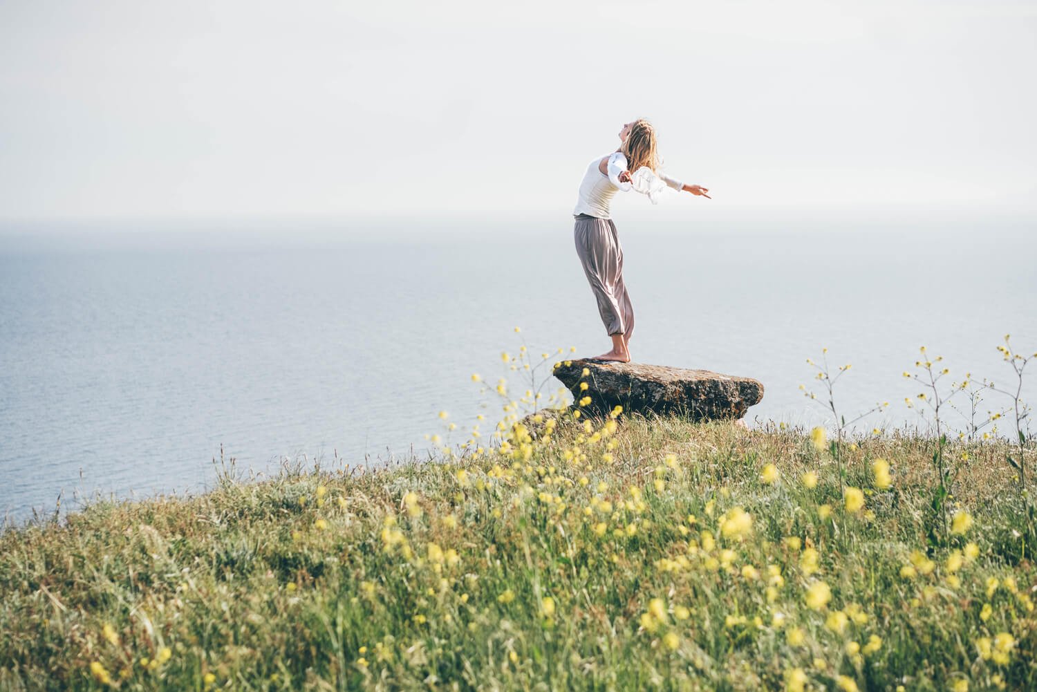 woman-taking-a-breath-on-a-majestic-mountain-and-s-DKGYDL6.jpg